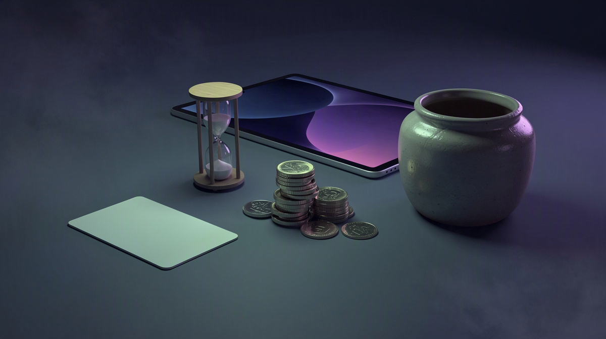 Coins, hourglass, blank card, and tablet arranged on a clean table to suggest time-based cost.